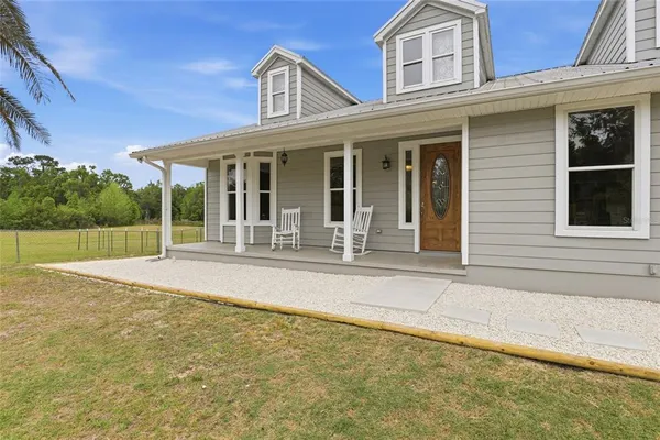 a view of a house with a swimming pool