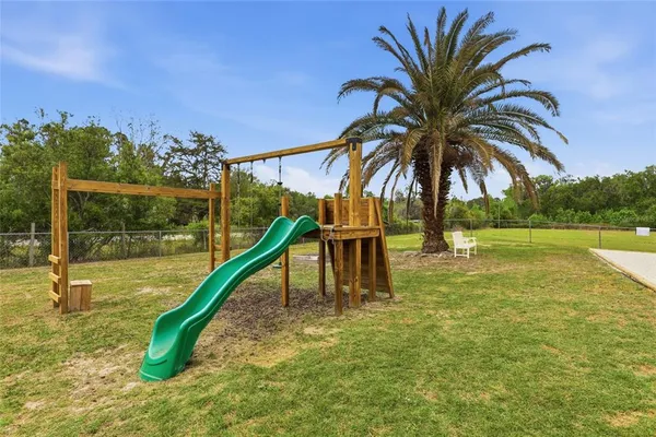 an aerial view of a house with swimming pool garden and mountain view