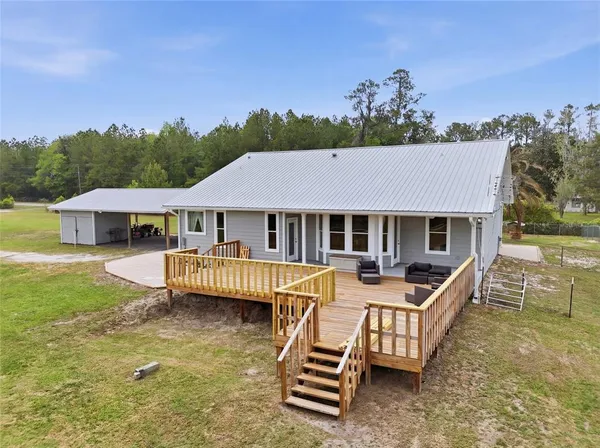 a view of a lake with houses in the back