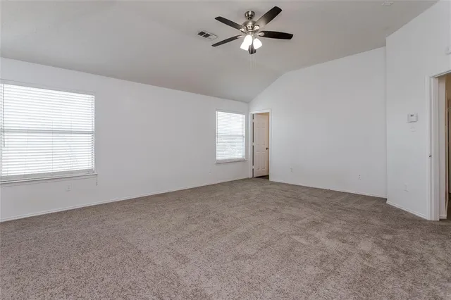 a view of empty room with windows
