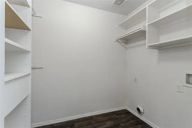 a view of a room with racks on the wall