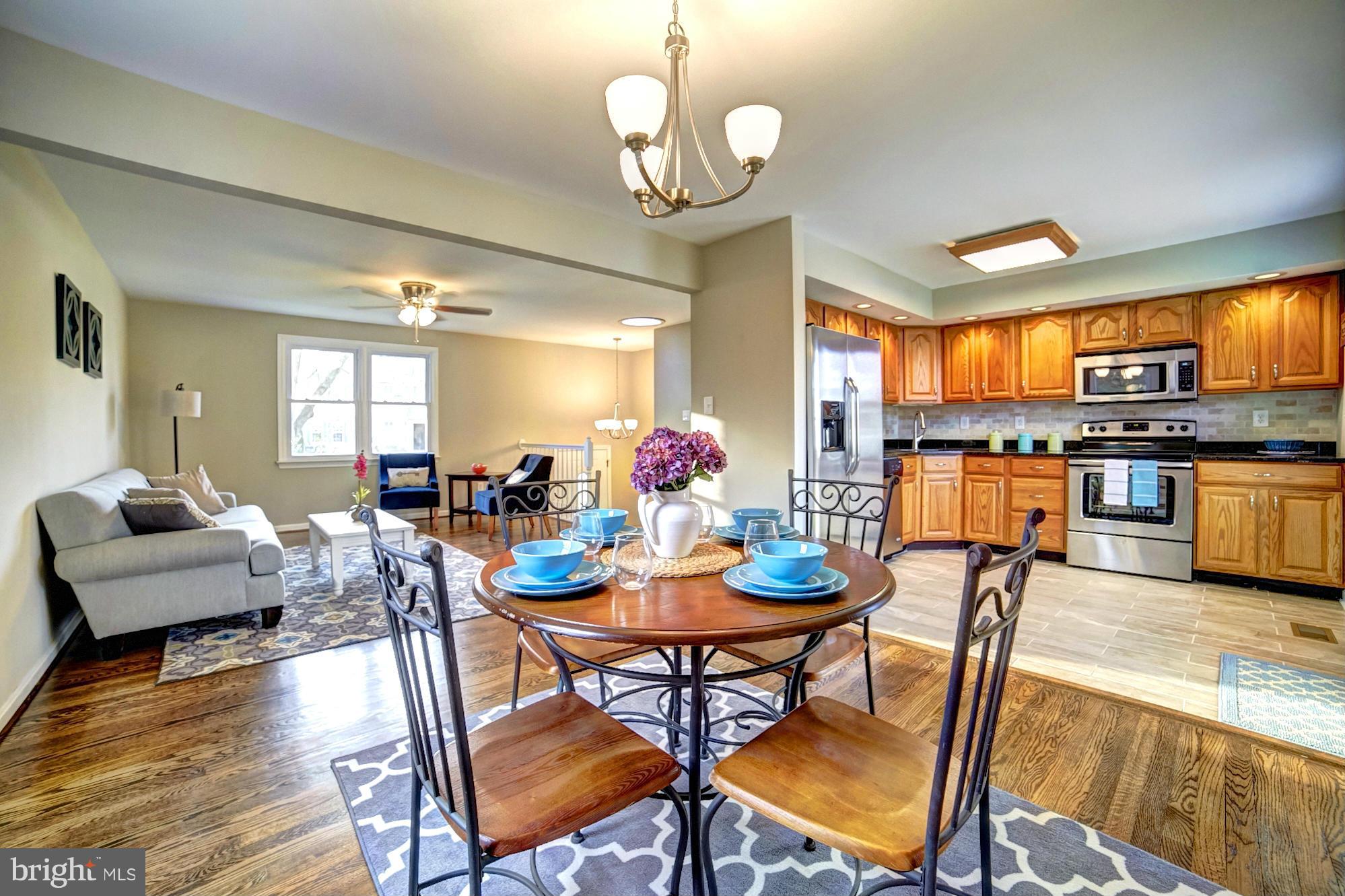 3811 Longley Road Abingdon, MD 21009 - Photo 1 of 21 a view of a dining room with furniture a chandelier and wooden floor