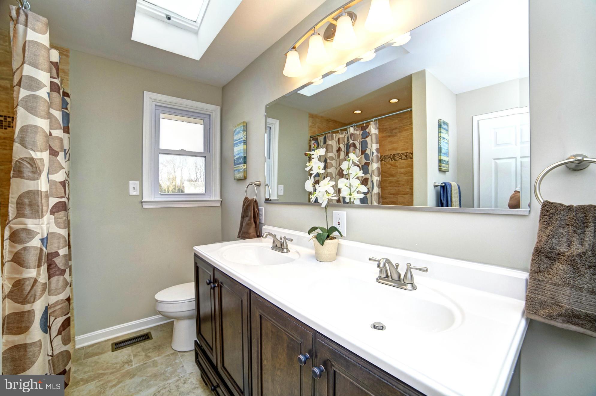 3811 Longley Road Abingdon, MD 21009 - Photo 11 of 21 a bathroom with a double vanity sink mirror and toilet