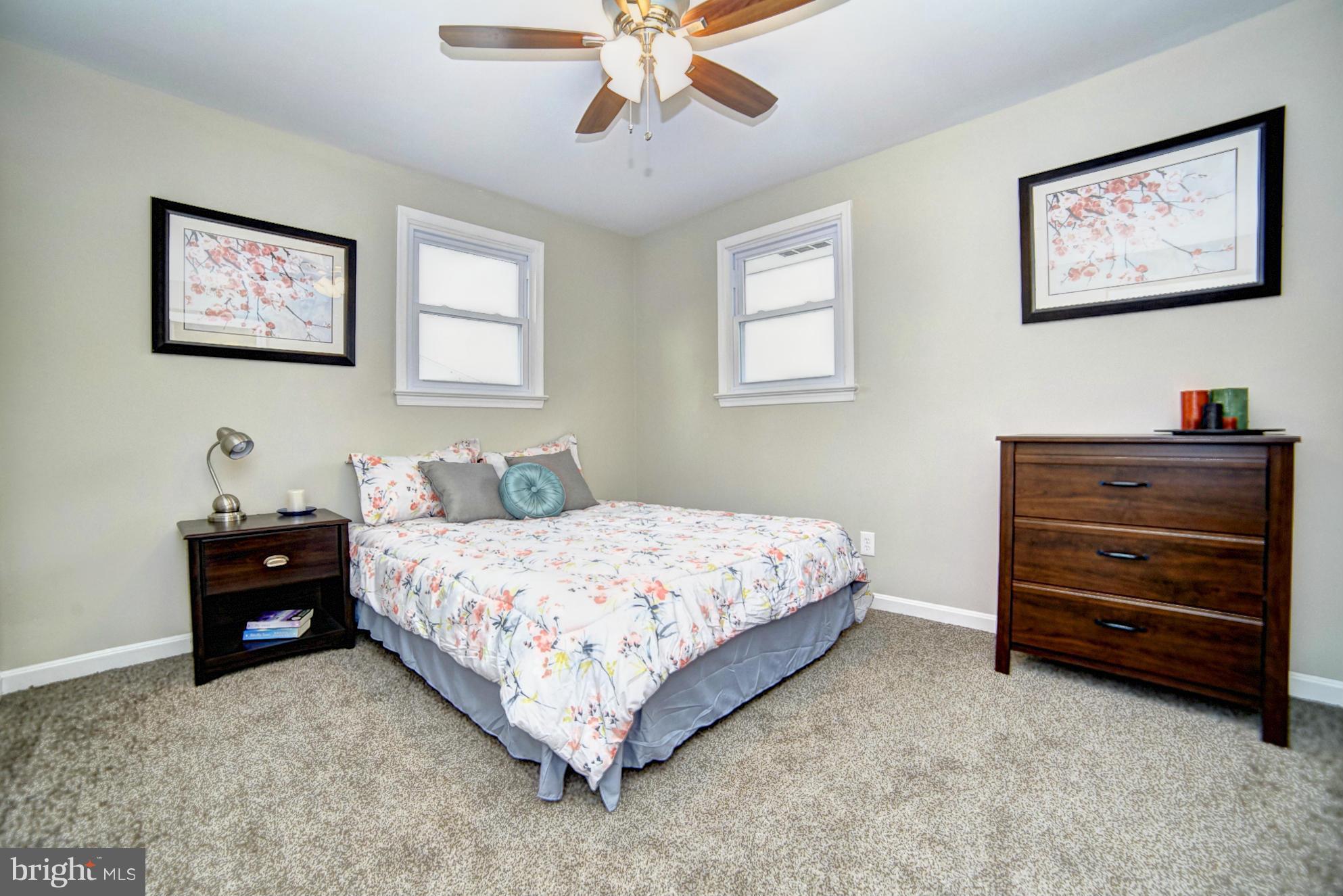 3811 Longley Road Abingdon, MD 21009 - Photo 7 of 21 a bedroom with a bed and a chandelier