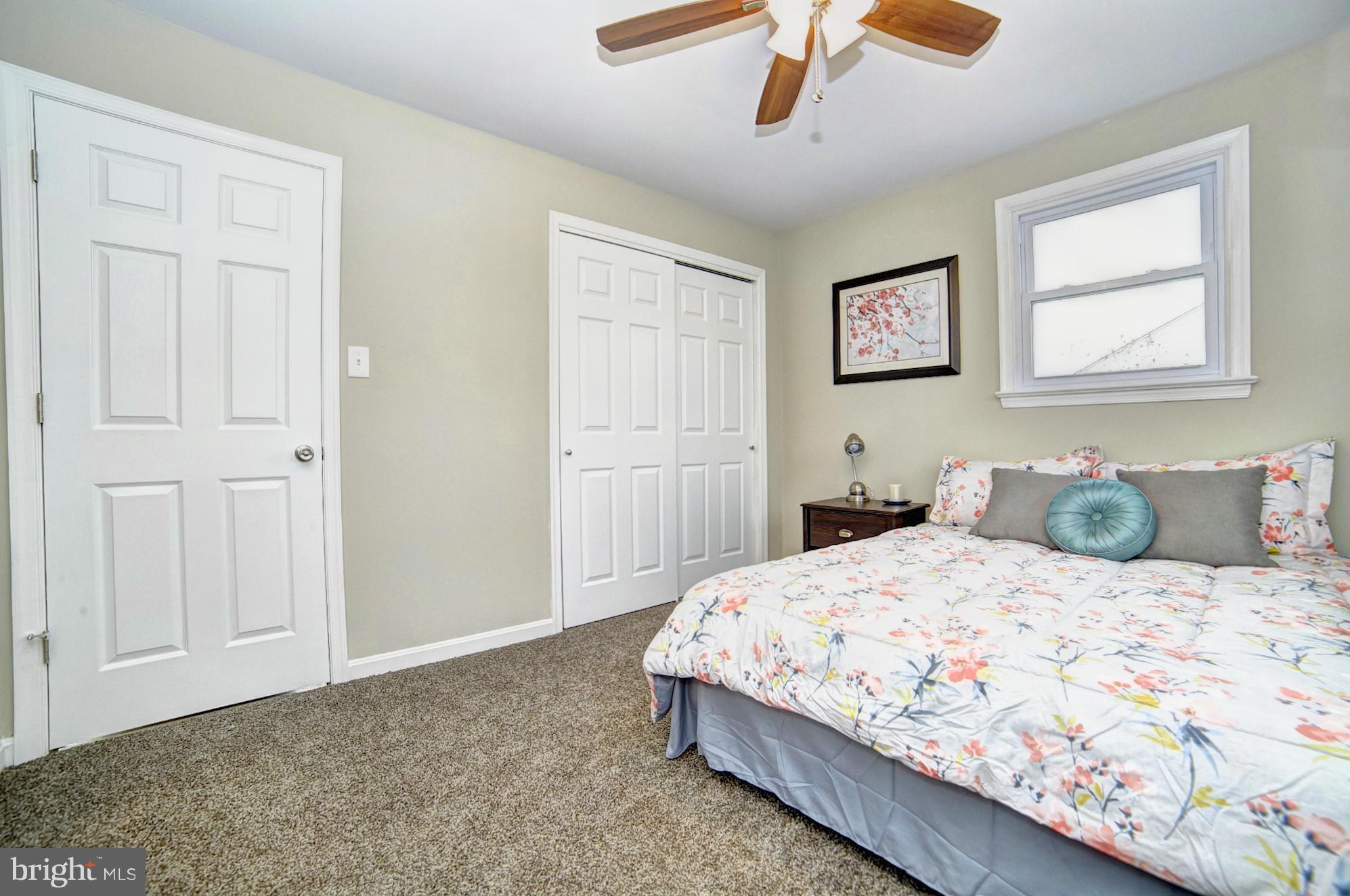 3811 Longley Road Abingdon, MD 21009 - Photo 8 of 21 a bedroom with a bed and a chandelier