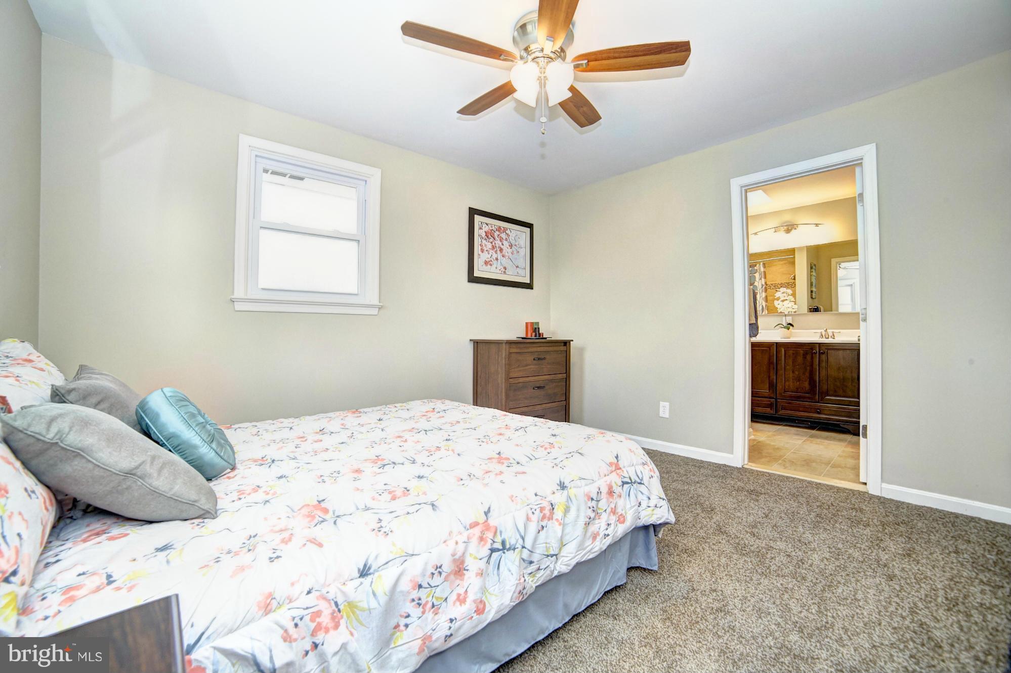 3811 Longley Road Abingdon, MD 21009 - Photo 9 of 21 a bedroom with a bed and a painting on the wall