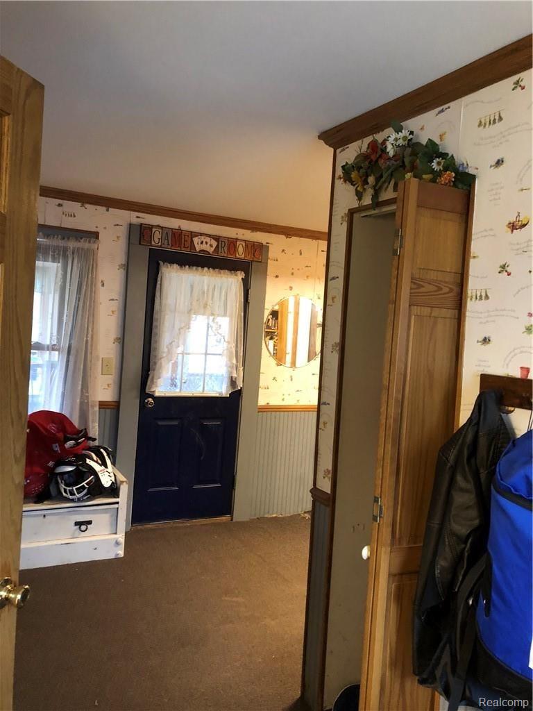 Entry door into a spacious Mudroom area