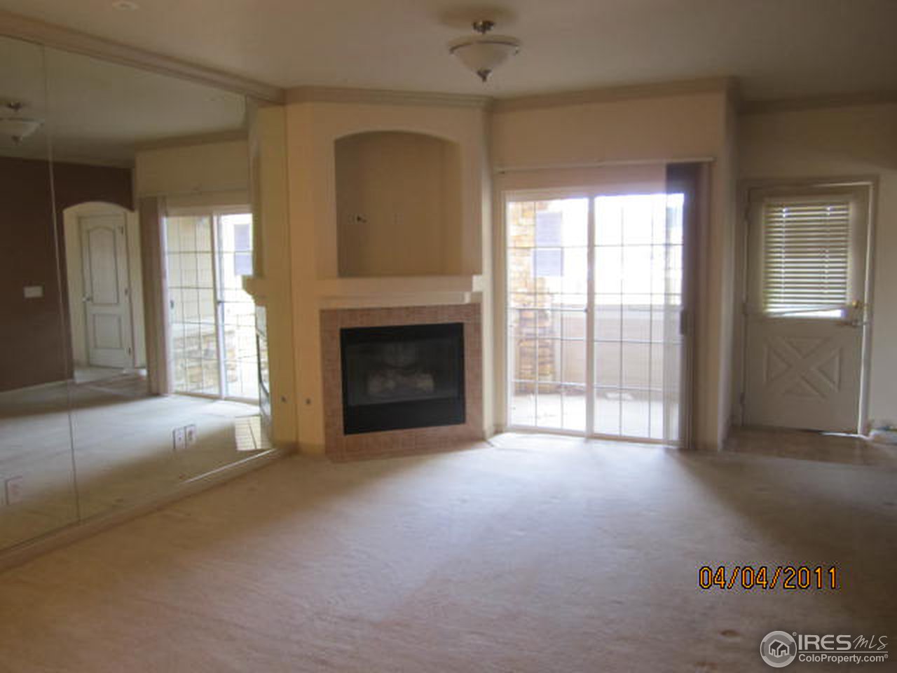 6607 West 3rd Street, Unit 1202 Greeley, CO 80634 - Photo 4 of 14 a view of empty room with a fireplace