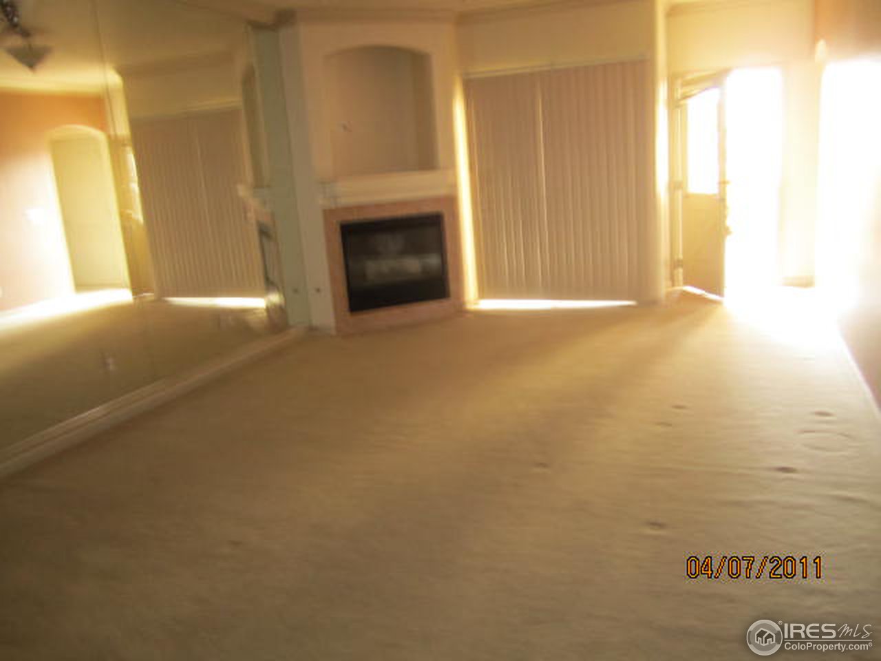 6607 West 3rd Street, Unit 1202 Greeley, CO 80634 - Photo 5 of 14 a view of empty room with floor to ceiling window
