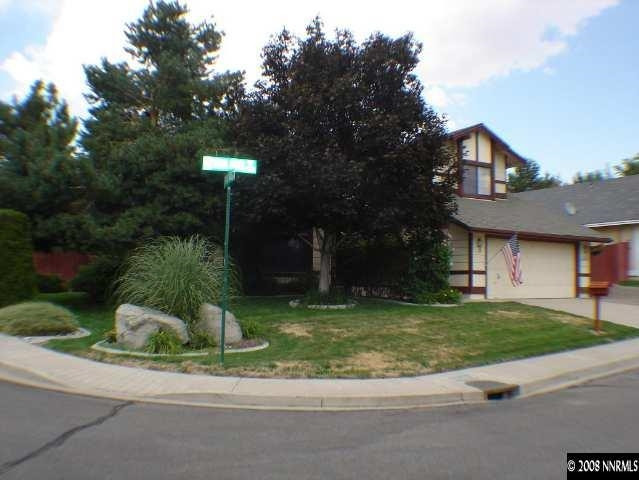 5395 Vista Ridge Way Reno, NV 89523 - Photo 1 of 1 a house that has a tree in front of it
