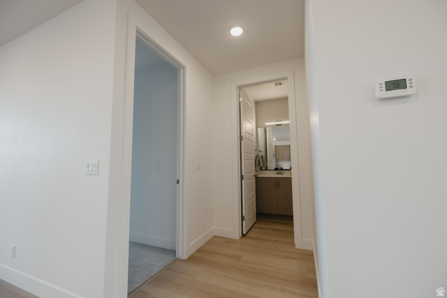 2759 Becco Trail, Unit 16 St. George, UT 84770 - Photo 37 of 42 Hallway with light wood-style floors and baseboards
