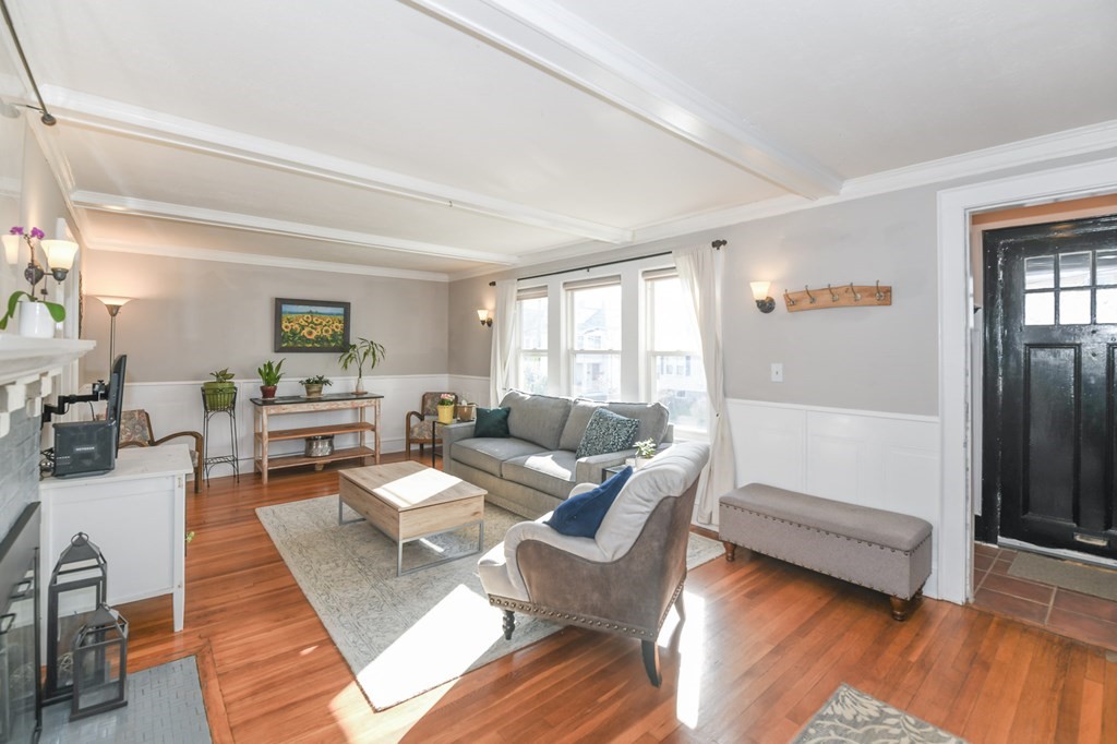 27 Fuller Road, Unit 27 Watertown, MA 02472 - Photo 3 of 13 a living room with furniture and wooden floor