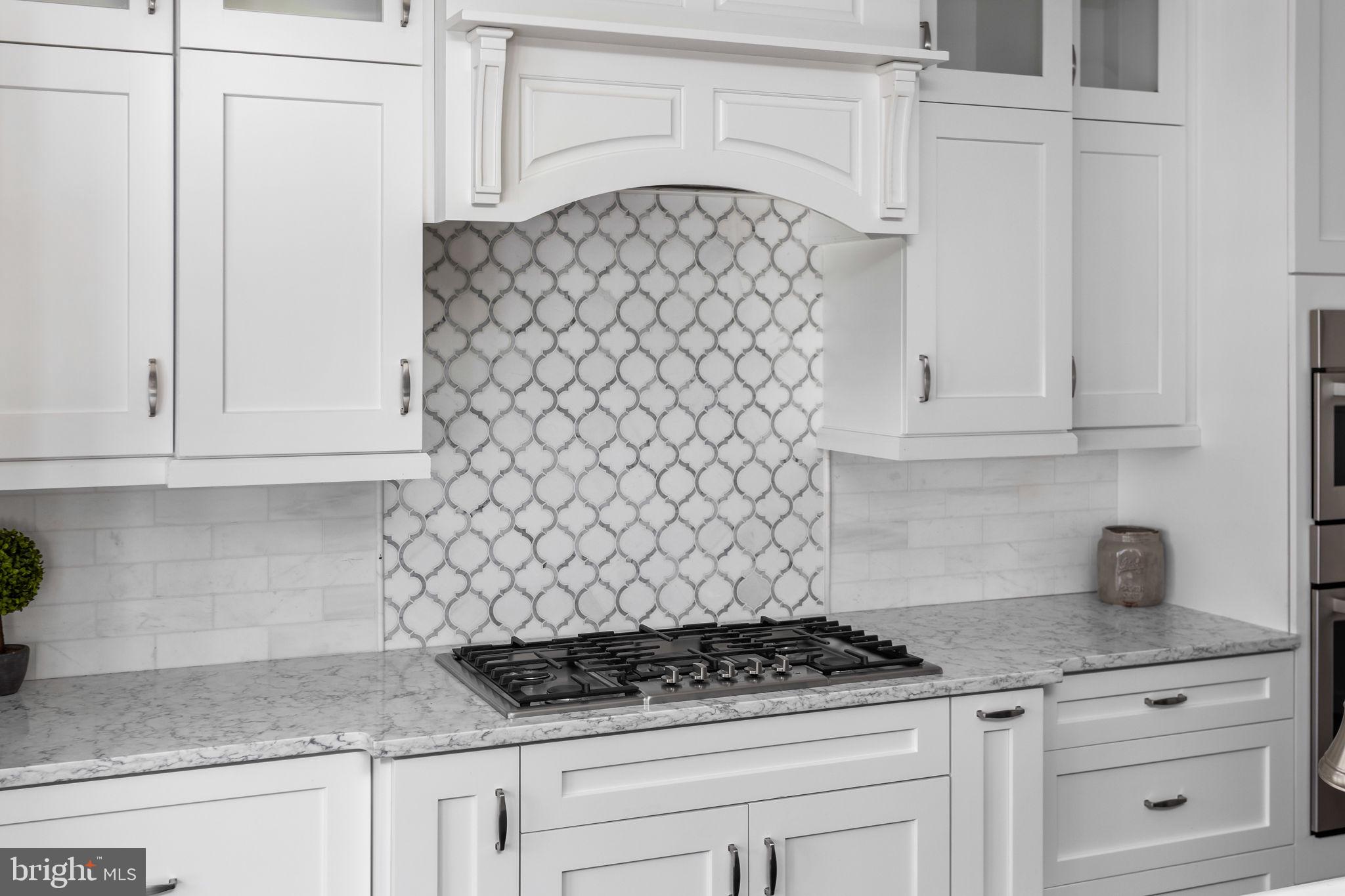 11 Nicholas Court Cream Ridge, NJ 08514 - Photo 19 of 67 Elegant white kitchen with chic backsplash.