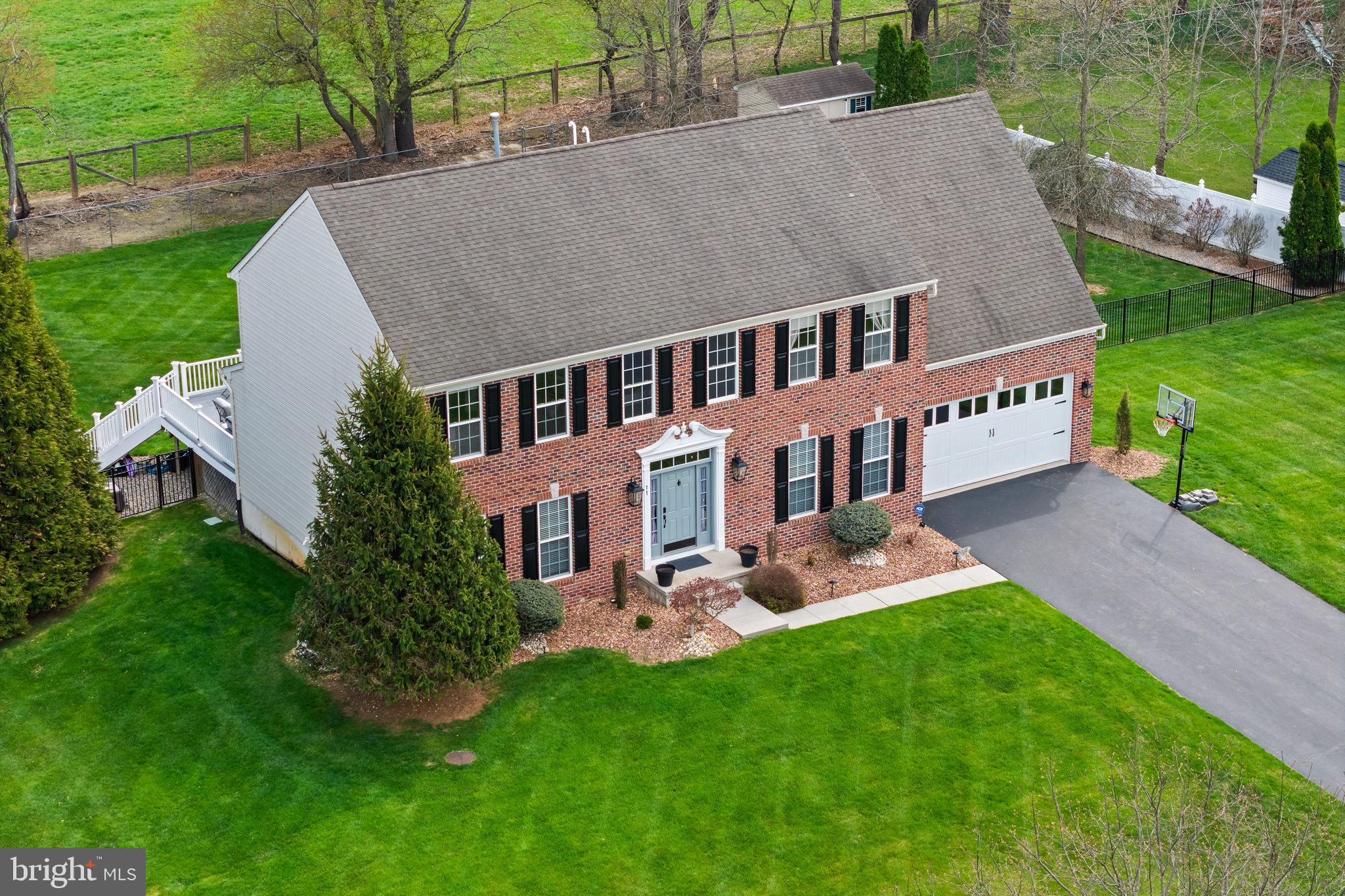 11 Nicholas Court Cream Ridge, NJ 08514 - Photo 2 of 67 Charming brick home with lush greenery.