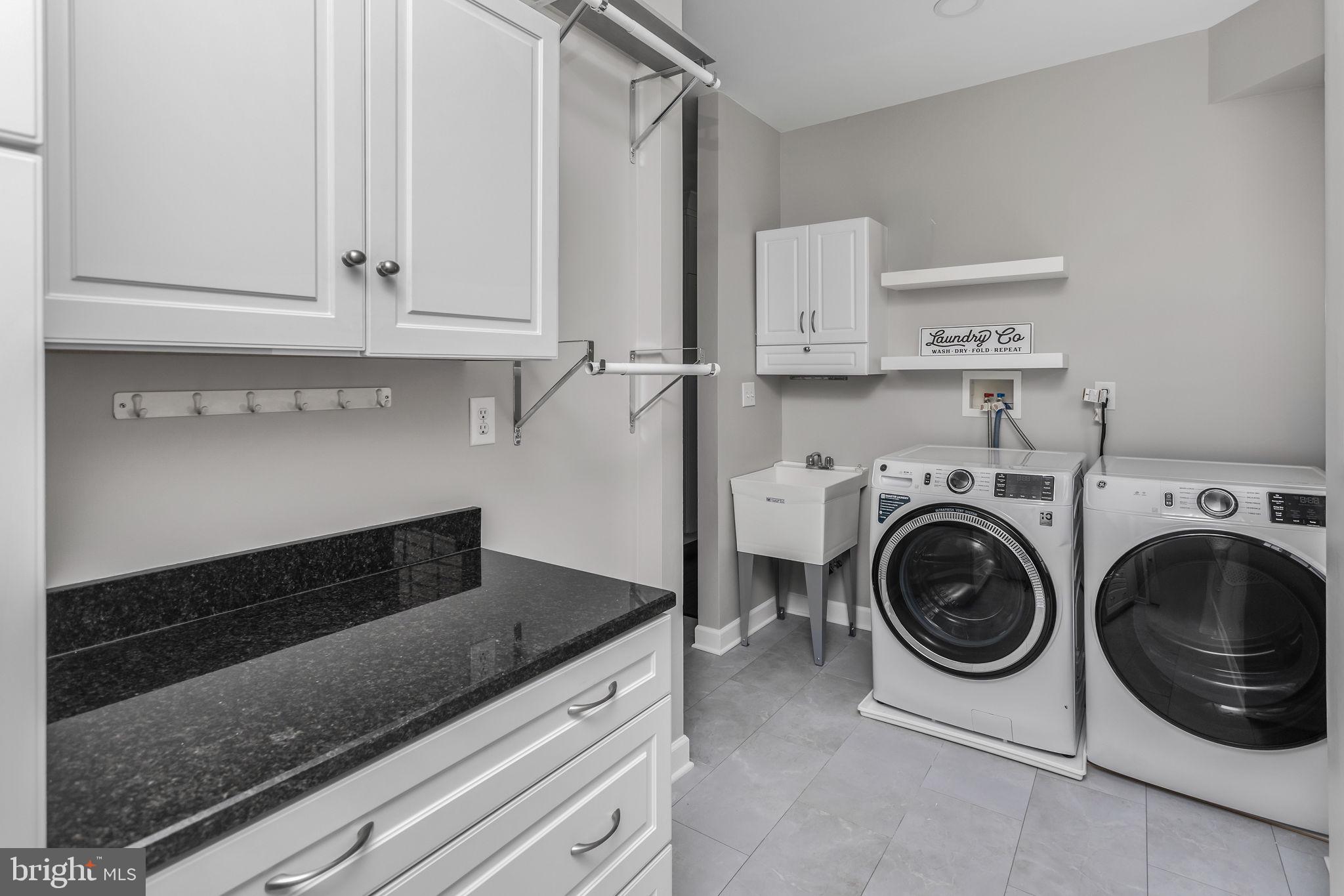11 Nicholas Court Cream Ridge, NJ 08514 - Photo 26 of 67 Sleek laundry room with modern finishes.