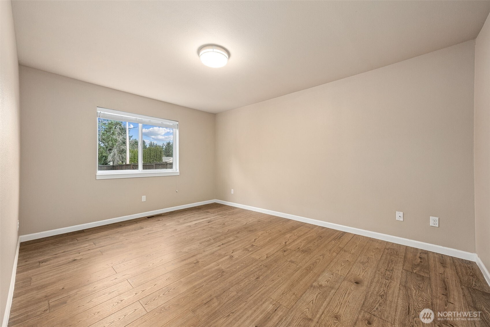 101 Murphy Lane South Rainier, WA 98576 - Photo 15 of 40 an empty room with wooden floor and windows