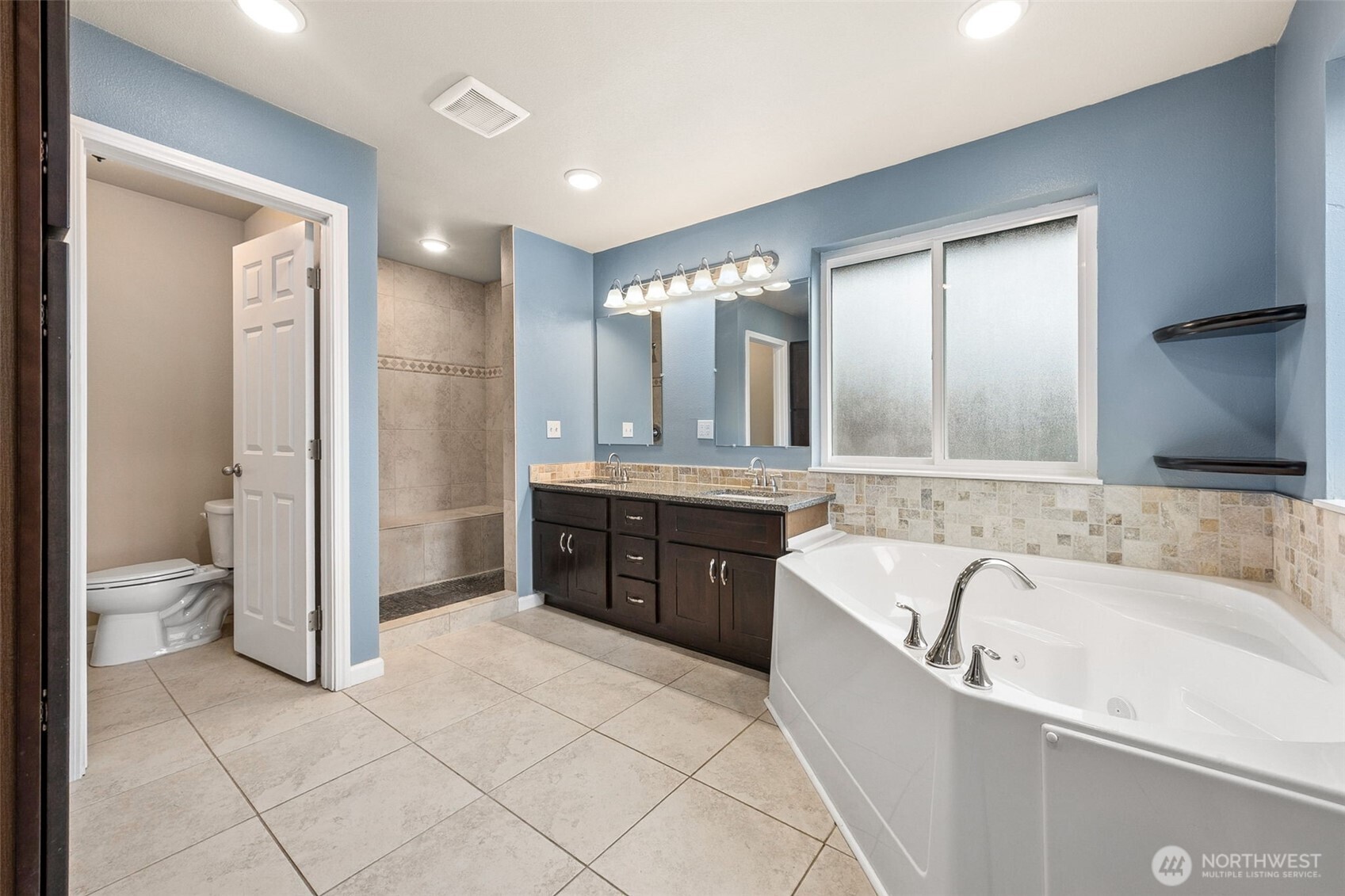 101 Murphy Lane South Rainier, WA 98576 - Photo 18 of 40 a large bathroom with a tub sink shower and mirror