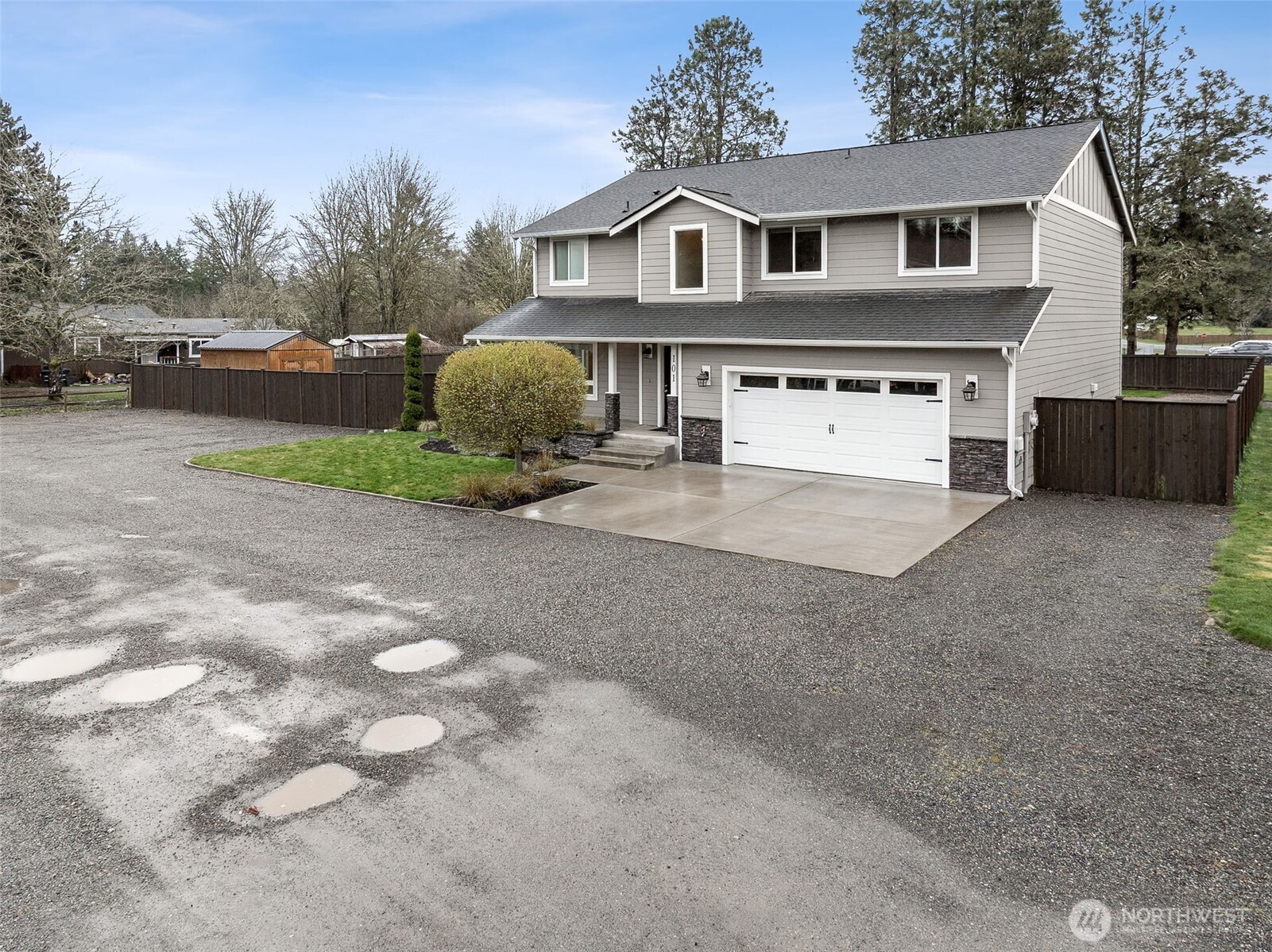 101 Murphy Lane South Rainier, WA 98576 - Photo 28 of 40 a front view of a house with a yard and garage