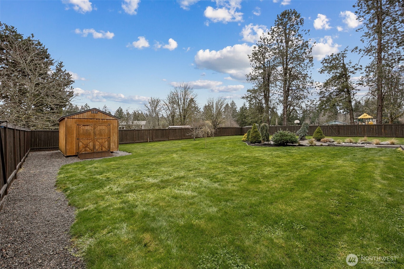 101 Murphy Lane South Rainier, WA 98576 - Photo 37 of 40 a backyard of a house with lots of green space