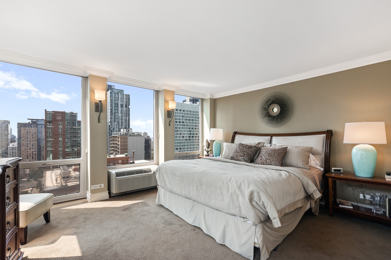 111 East Chestnut Street, Unit 25K Chicago, IL 60611 - Photo 13 of 28 a bedroom with a large bed and a large window