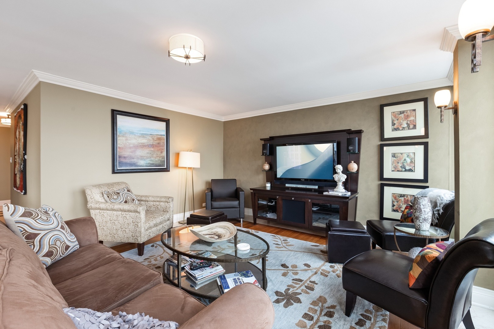 111 East Chestnut Street, Unit 25K Chicago, IL 60611 - Photo 5 of 28 a living room with furniture and a flat screen tv