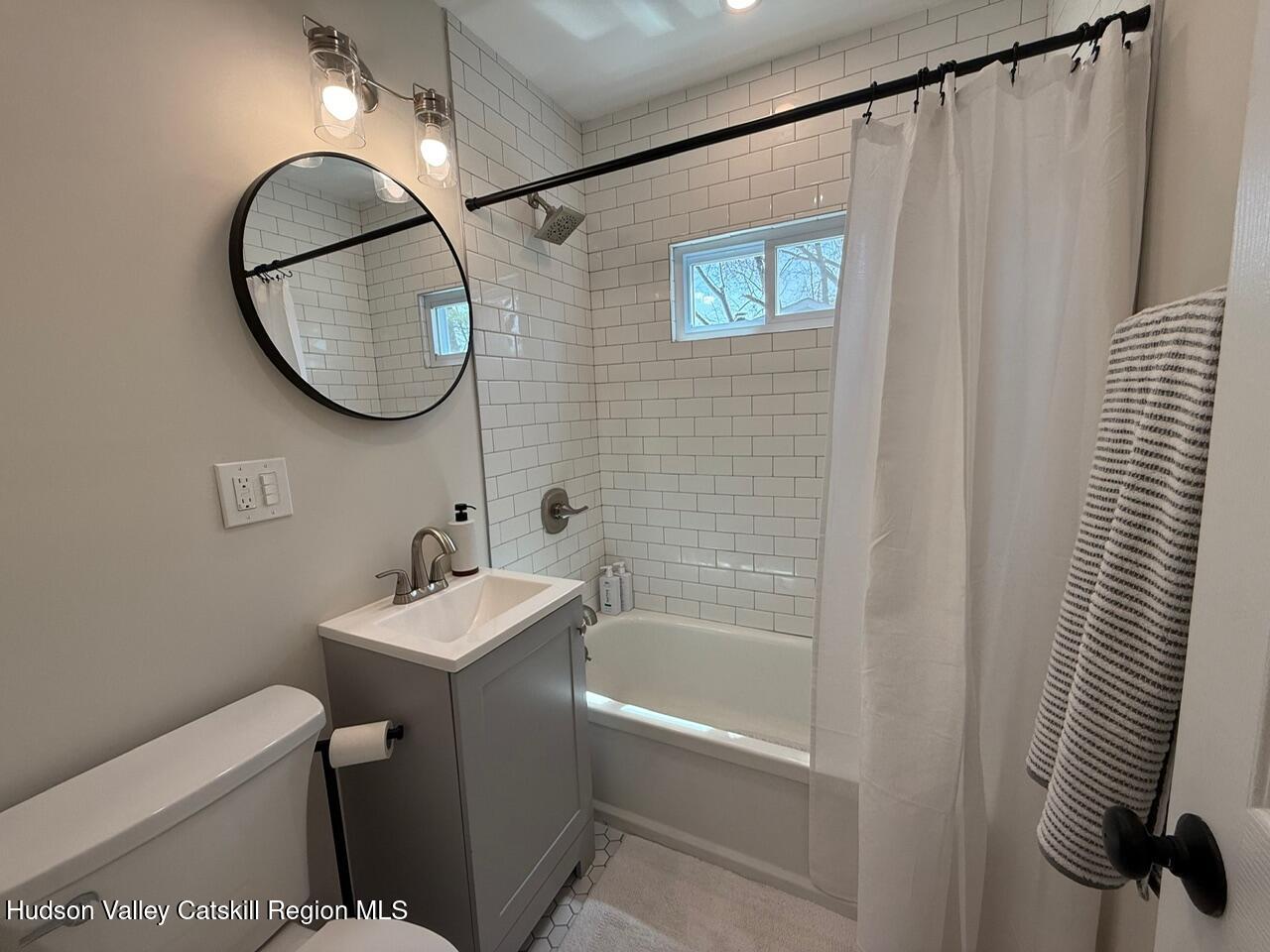 7 Park Circle High Falls, NY 12440 - Photo 18 of 31 a bathroom with a sink a mirror a toilet and a shower