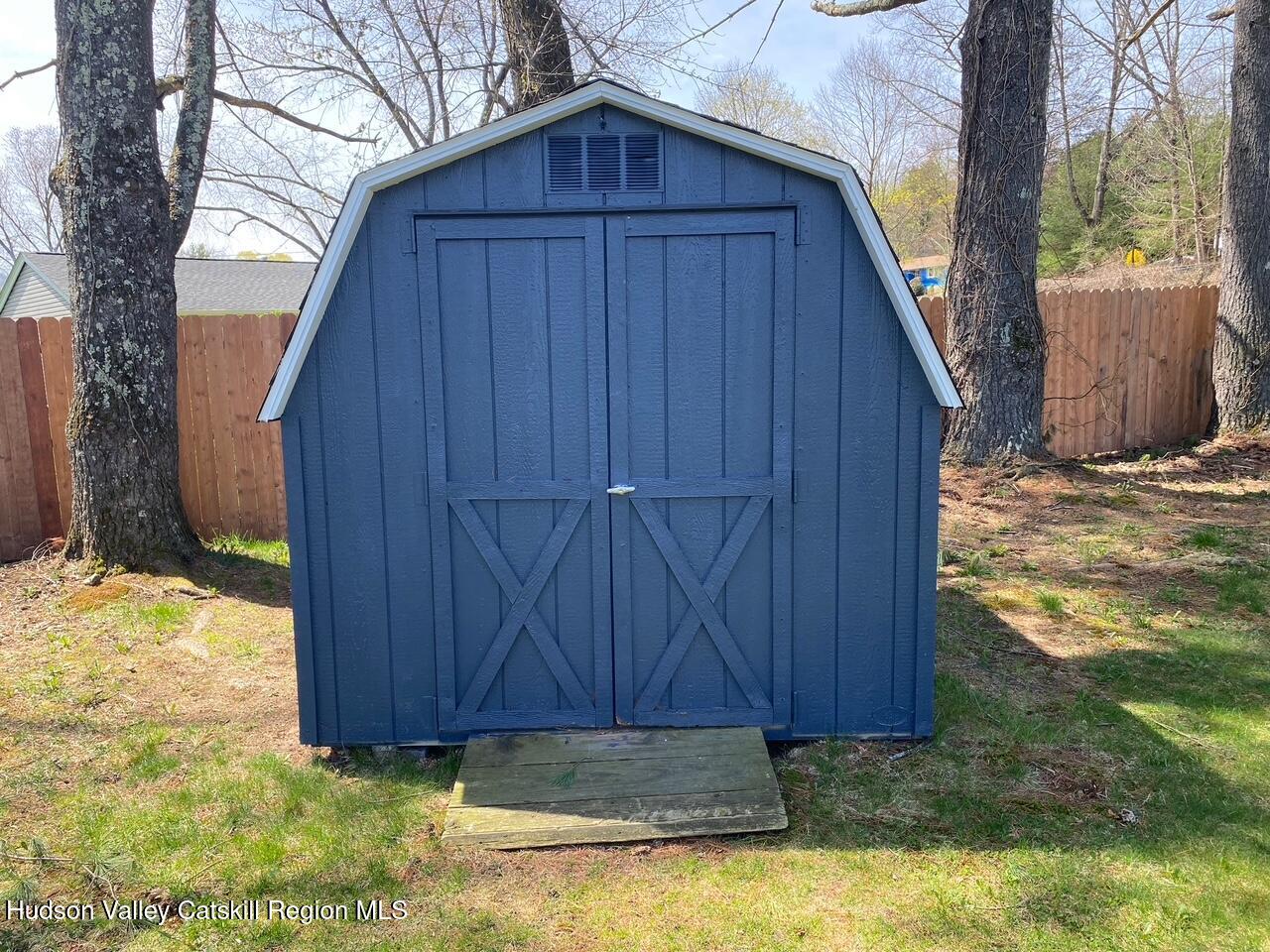 7 Park Circle High Falls, NY 12440 - Photo 5 of 31 a view of backyard with wooden fence and a large tree