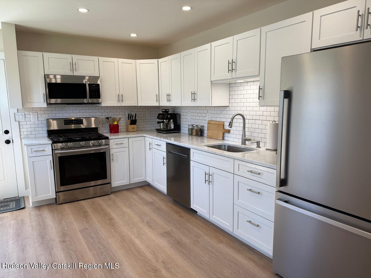7 Park Circle High Falls, NY 12440 - Photo 10 of 31 a kitchen with granite countertop white cabinets and stainless steel appliances