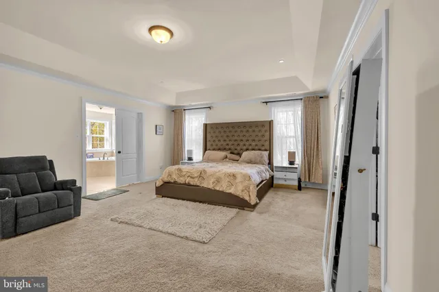 a bed room with a bed and a couch