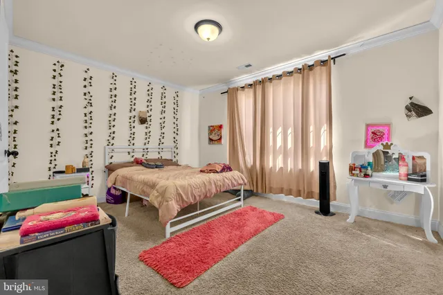 a view of a dining room with furniture a chandelier and wooden floor