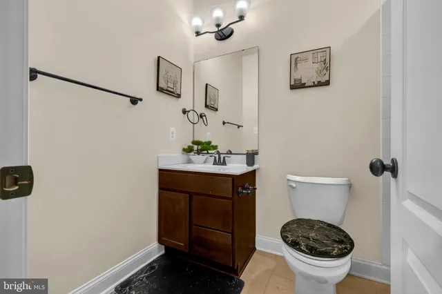 a view of an entryway with wooden floor and a livingroom view