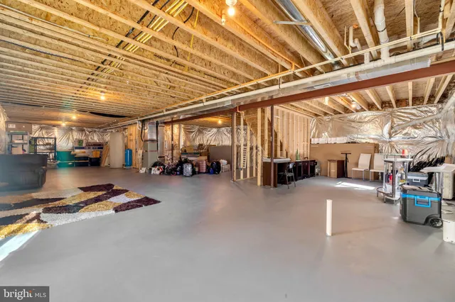 a bathroom with a shower sink and mirror