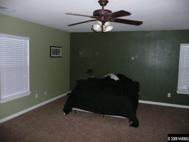 9010 Yeager Street Reno, NV 89506 - Photo 5 of 9 a bed sitting in a room next to a window