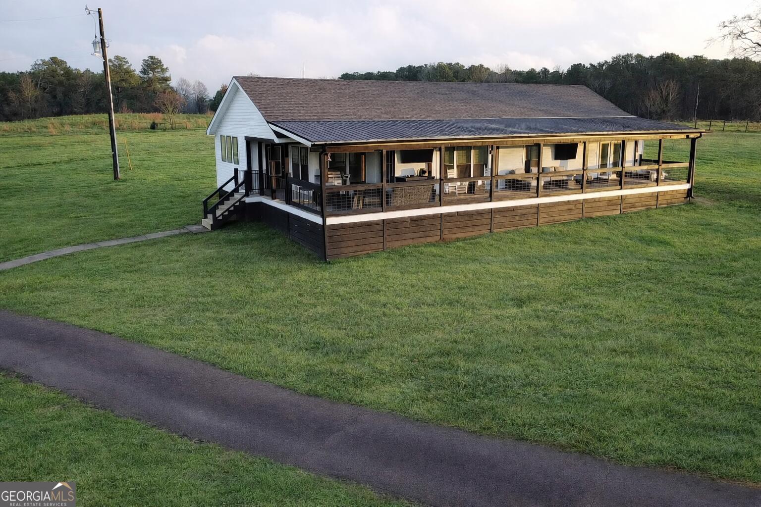 a view of a house with a big yard