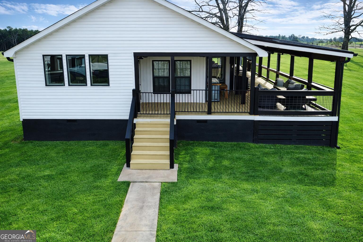 1900 Highway 212 Monticello, GA 31064 - Photo 15 of 20 a front view of a house with a garden and yard