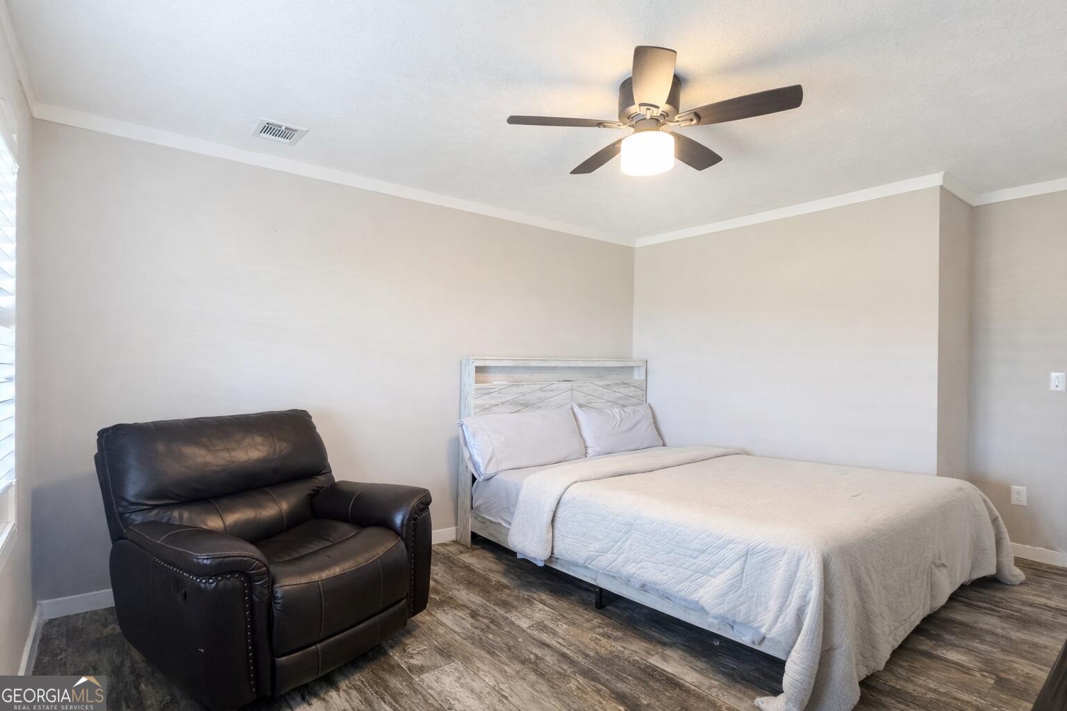 1900 Highway 212 Monticello, GA 31064 - Photo 9 of 20 a bedroom with a bed couch and window