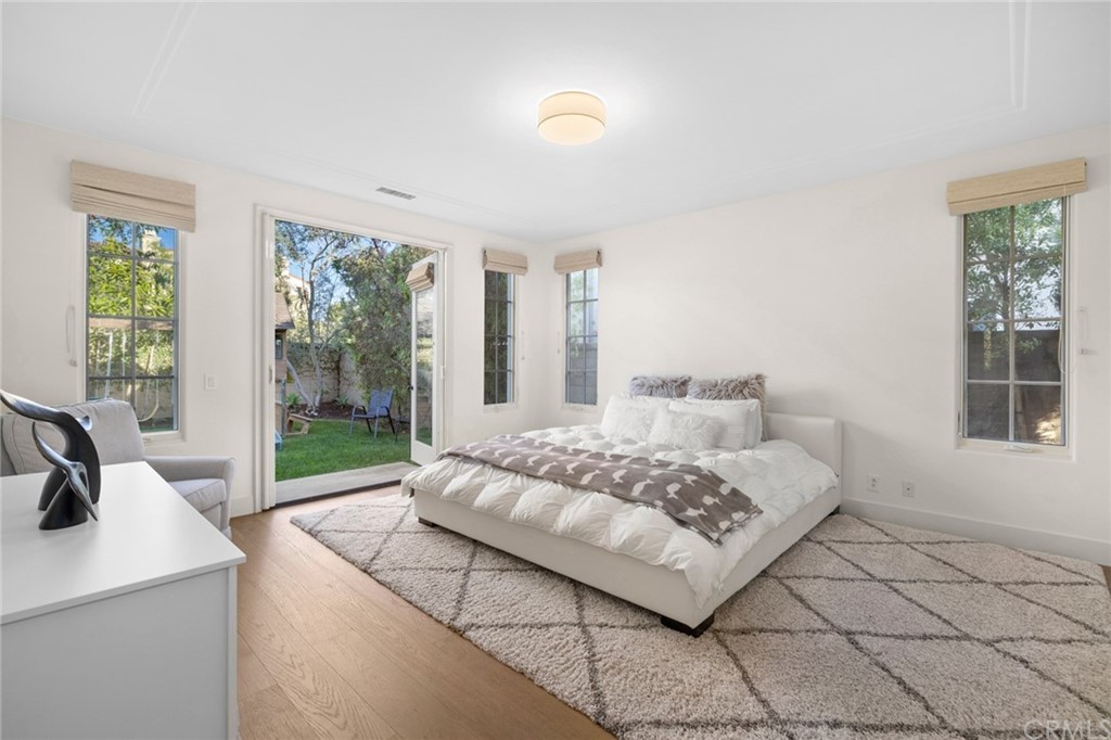 7 Hidden Pass Newport Coast, CA 92657 - Photo 12 of 30 a bedroom with a bed and a large window