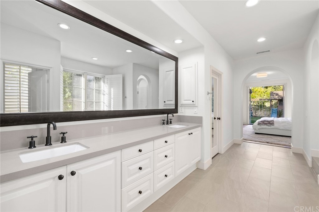 7 Hidden Pass Newport Coast, CA 92657 - Photo 14 of 30 a spacious bathroom with a double vanity sink double and mirror