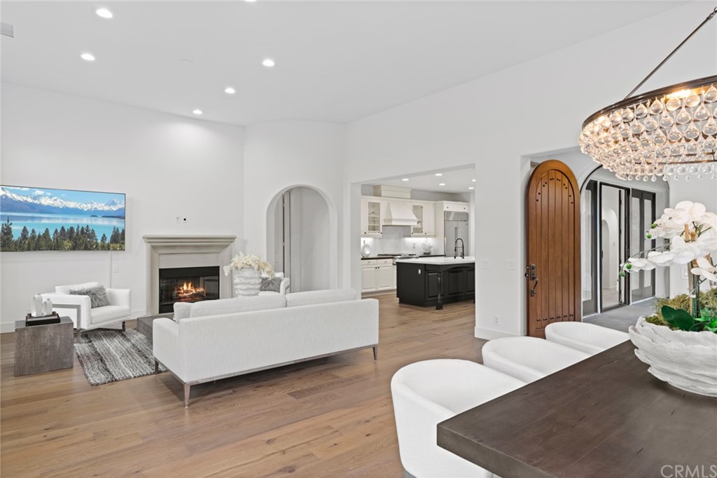 7 Hidden Pass Newport Coast, CA 92657 - Photo 16 of 30 a living room with furniture a fireplace and a table