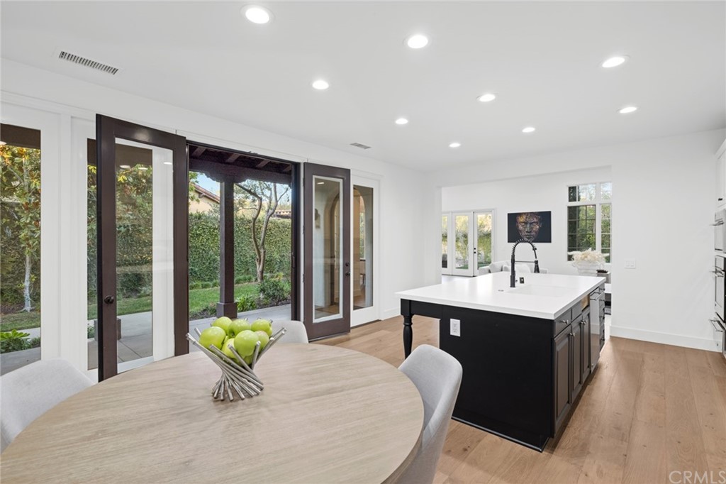 7 Hidden Pass Newport Coast, CA 92657 - Photo 17 of 30 a living room with a sink a table and chairs