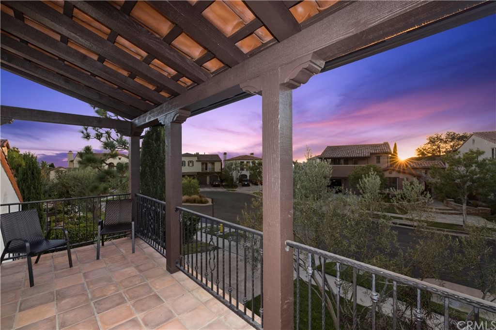 7 Hidden Pass Newport Coast, CA 92657 - Photo 24 of 30 a view of a porch with a table and chairs