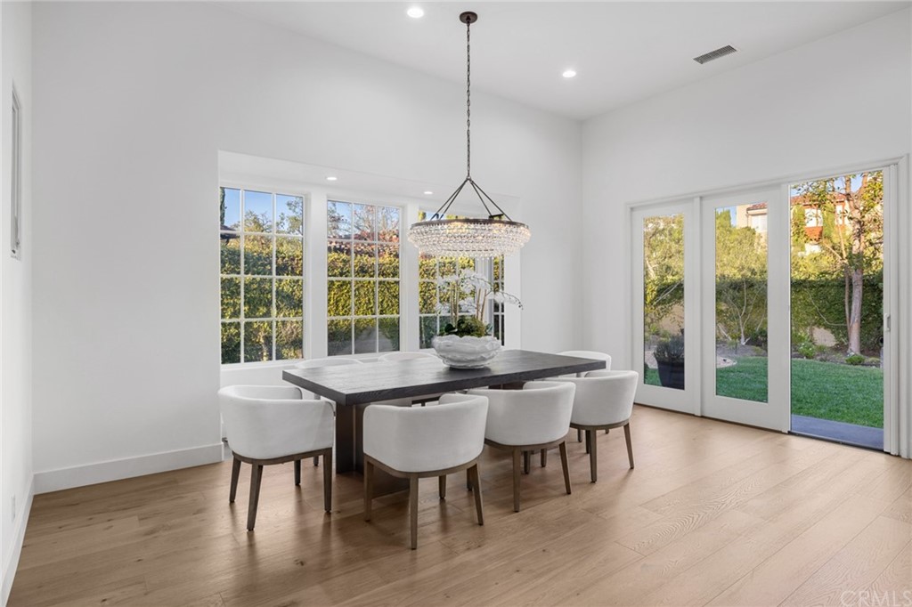 7 Hidden Pass Newport Coast, CA 92657 - Photo 7 of 30 a view of a dining room with furniture window and wooden floor