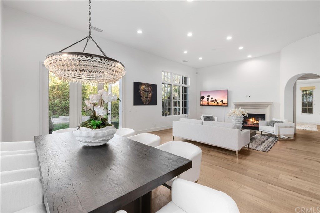 7 Hidden Pass Newport Coast, CA 92657 - Photo 9 of 30 a living room with furniture and a chandelier