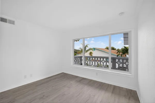 a view of outdoor space with wooden floor and window