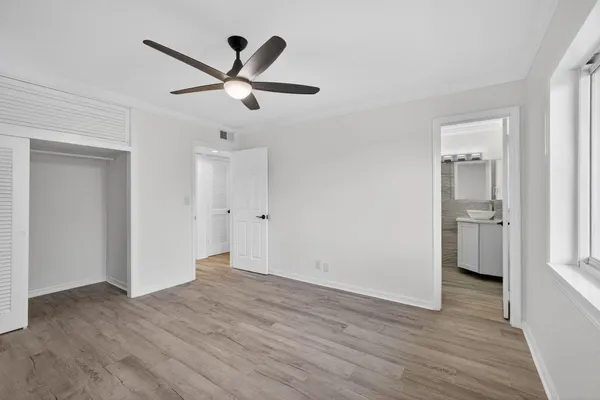 a view of a livingroom with a ceiling fan & a ceiling fan