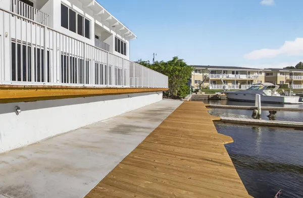 an aerial view of a houses with a lake view