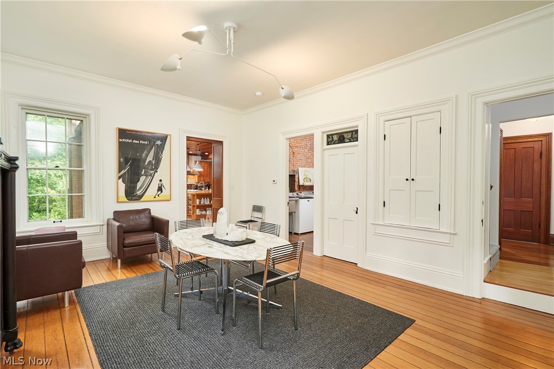 5046 Alger Road Richfield, OH 44286 - Photo 18 of 49 Hardwood flooring and crisp white walls define this room, featuring a white multi-directional ceiling light fixture