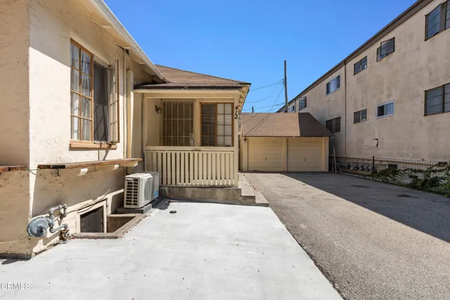 a view of a house with a street