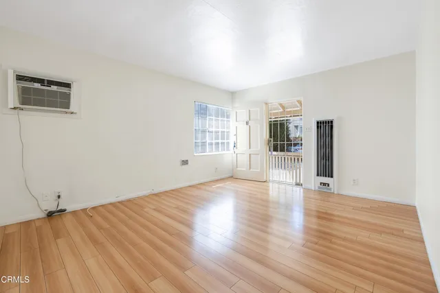 a kitchen with cabinets and white appliances