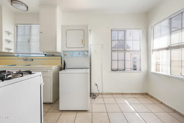 a bathroom with a sink a bathtub and a mirror